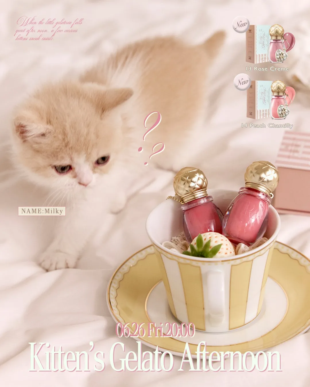 ティーカップに入ったリップグロスとそれを見つめる子猫のイメージショット
